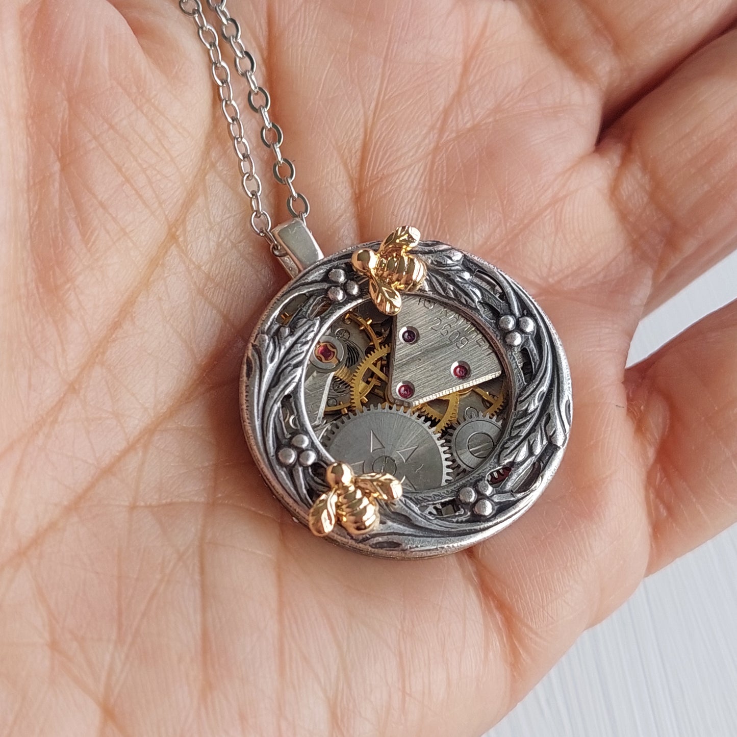 Timepiece Berries and Vines Wreath Pendant with Bee - Brass or Silver