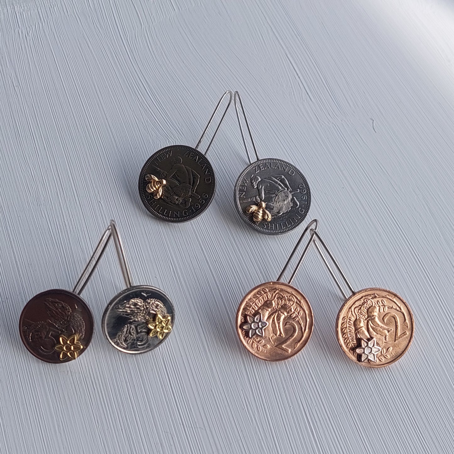 Re-minted Artisan Coin Earrings with Tiny Flowers