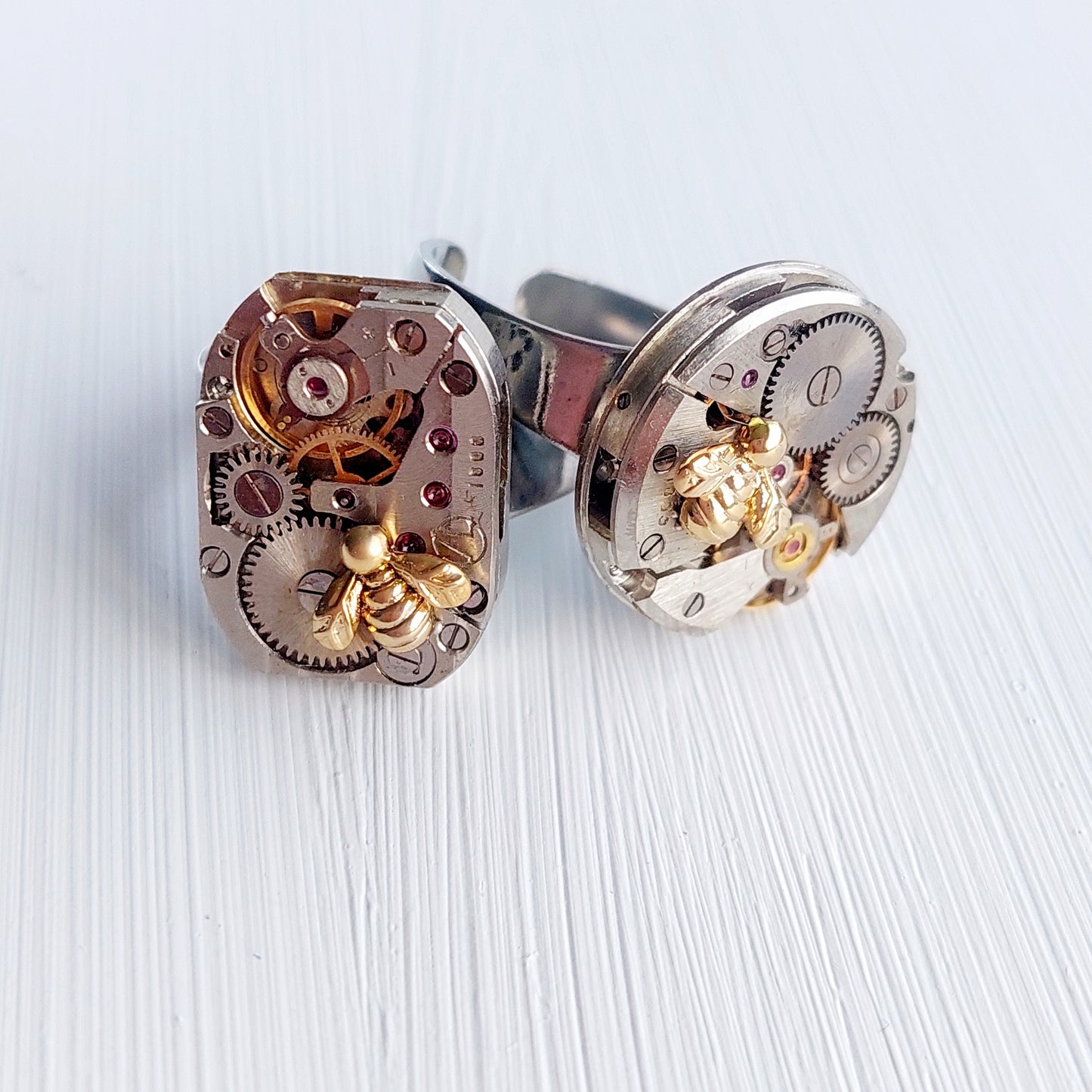 Timepiece ring with tiny gold bee