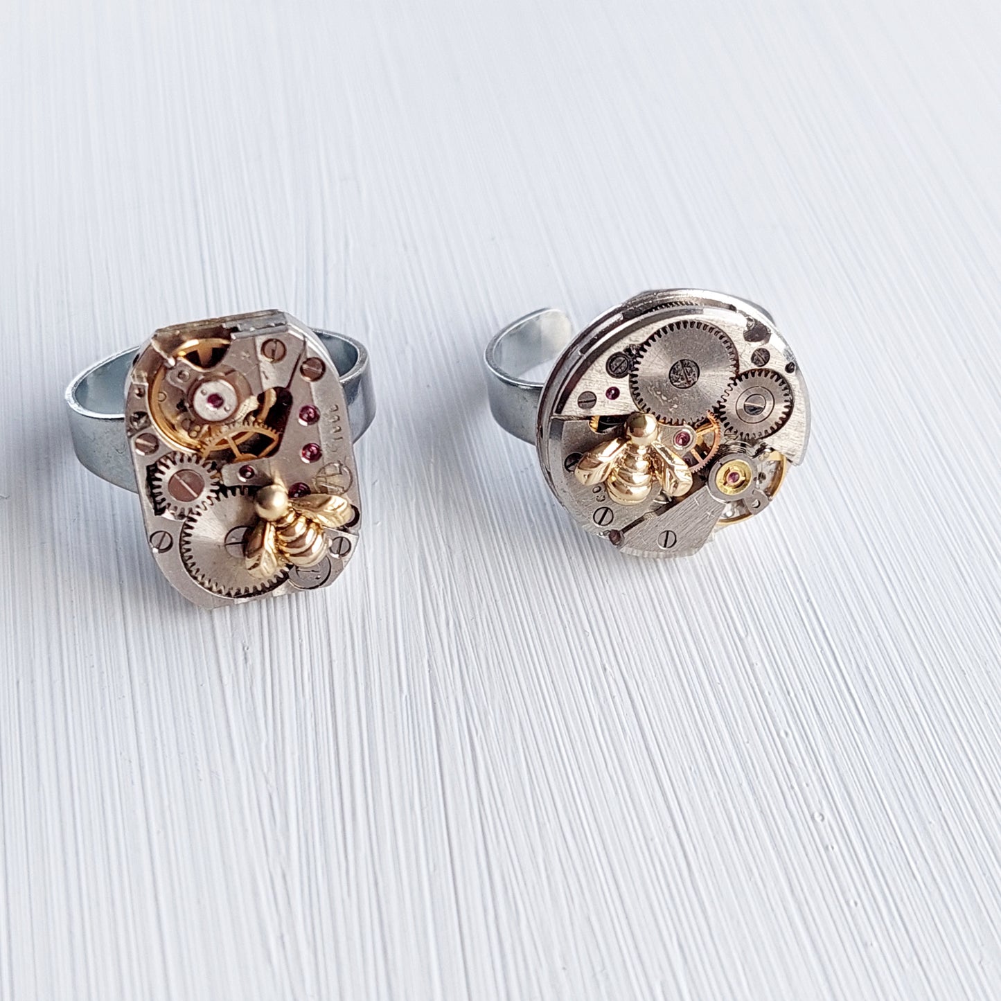 Timepiece ring with tiny gold bee