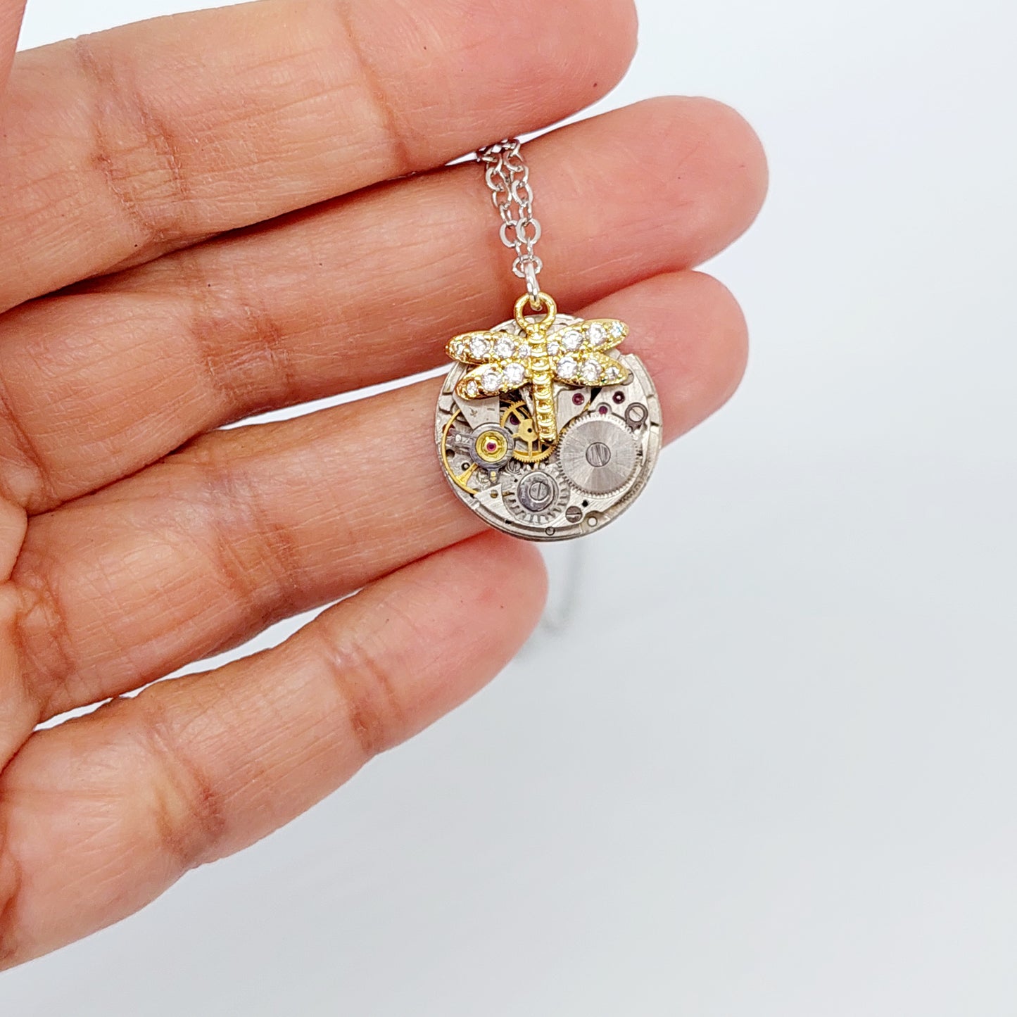 Mini timepiece pendant with sparkling dragonfly