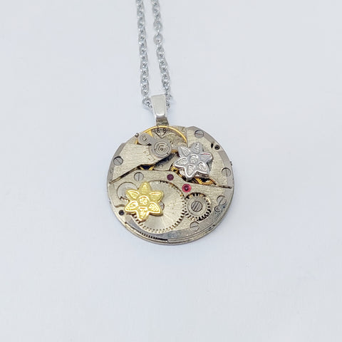 NEW!! Small timepiece pendant with mixed metal flowers